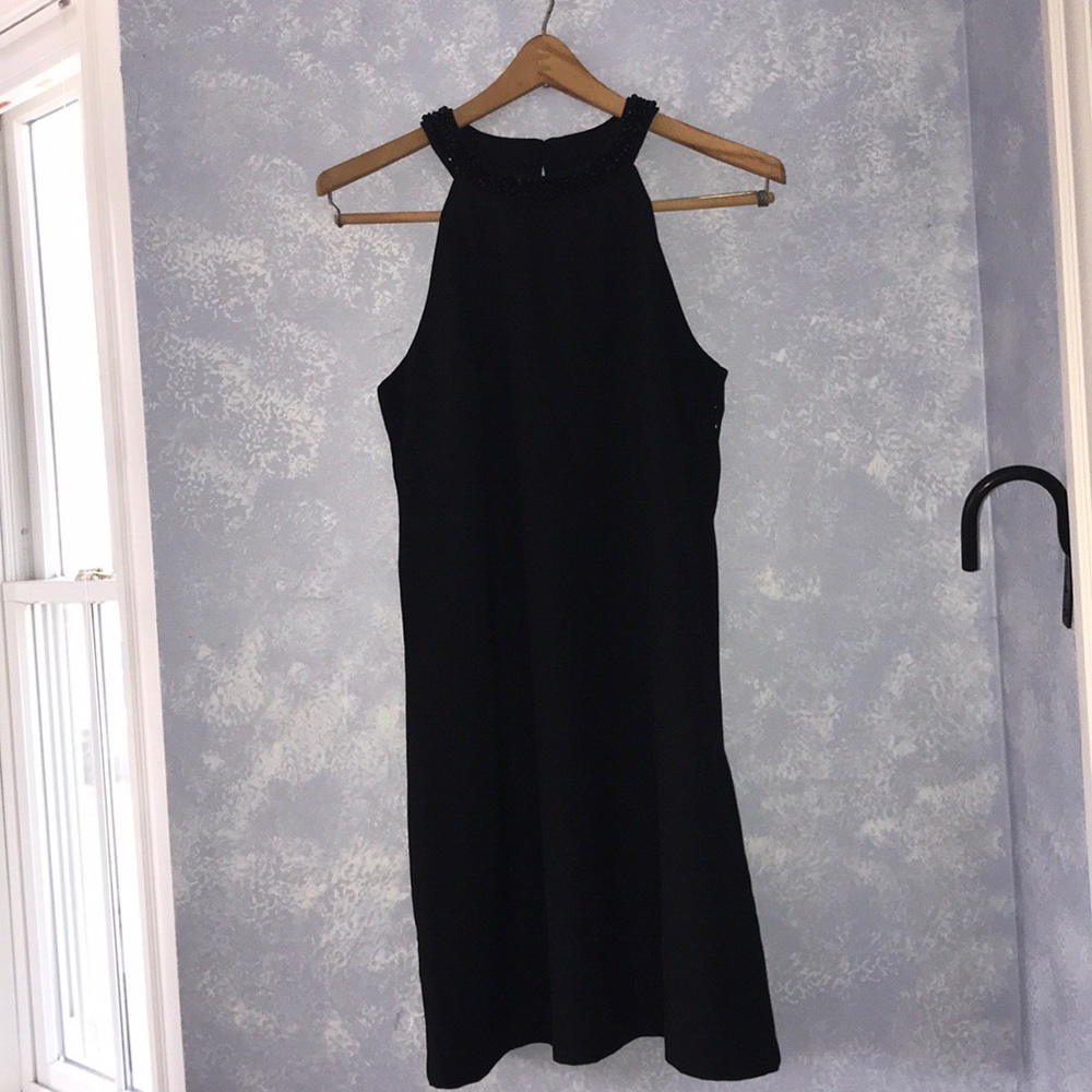 Elegant black sleeveless cocktail dress